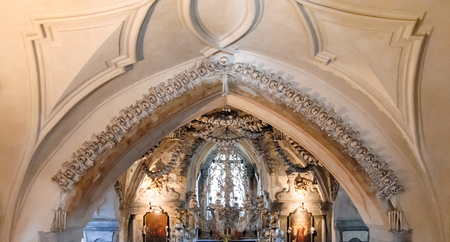 KUTNA HORA, SLOVAKIA - JULY 8, 2009: Sedlec Ossuary (aka Church of Bones) beneath the Cemetery Church of All Saints, contains over 40,000 skeletons whose bones are artistically arranged as decorationsのeditorial素材