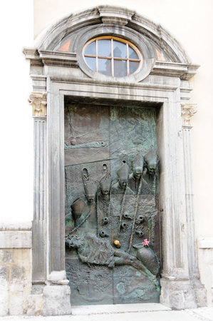 LJUBLJANA, SLOVENIA - JULY 9, 2009: Bronze side door of St. Nicholas Cathedral sculpted with portraits of the 20th century bishops of Ljubljanaのeditorial素材