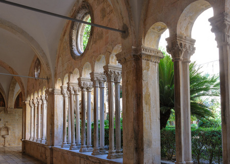 DUBROVNIK, CROATIA - SEPTEMBER 1, 2009: Double column colonnades with individualized capitals along the cloister of the Franciscan monasteryのeditorial素材