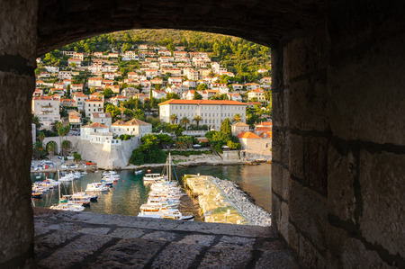DUBROVNIK, CROATIA - AUGUST 31, 2009: Old city port breakwater and Gymnasium viewed from St. John's fortのeditorial素材