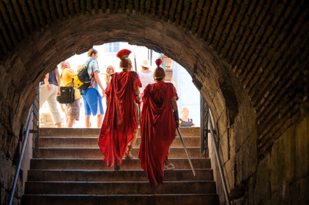 SPLIT, CROATIA - SEPTEMBER 2, 2009: Roman soldiers walking out to the east side of the Peristyle...