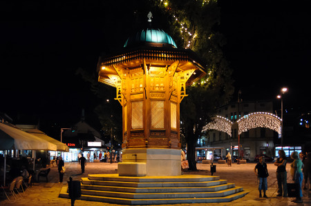 SARAJEVO, BOSNIA AND HERZEGOVINA - SEPTEMBER 4, 2009: The Sebilj wooden water fountain (Sebil), illuminated at nightのeditorial素材