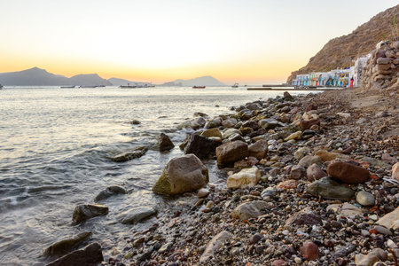 MELOS, GREECE - SEPTEMBER 2, 2012: Klima, a traditional fishing village with 2-storey houses called Syrmata built in the concavities of the rocks. The ground floor housed the fishermen's boats.のeditorial素材