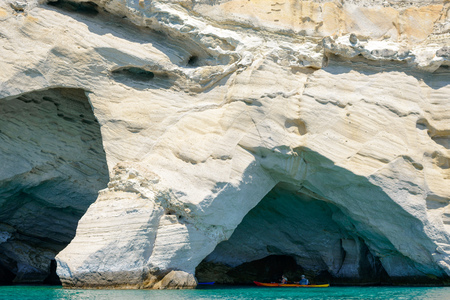 MELOS, GREECE - SEPTEMBER 4, 2012: People with kayaks exploring the Blue Cave at Kleftiko, at the southwest coastline of Melos island.のeditorial素材