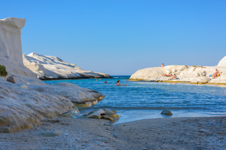 MELOS, GREECE - SEPTEMBER 4, 2012: Sarakiniko cove, beach and gorge with people sunbathing and swimming.のeditorial素材