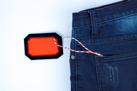Online shopping of China, The jeans and shopping tag on a white background with copy space for text....