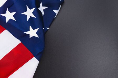US American flag on black background. For USA Memorial day,  Memorial day, Presidents day, Veterans day, Labor day, Independence day, or 4th of July celebration. Top view, copy space for text.の写真素材