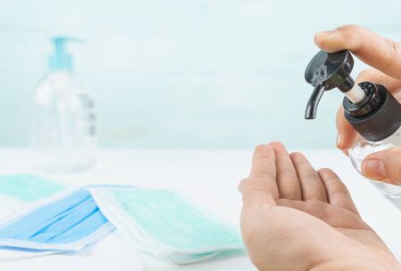Male hand using alcohol gel clean hand hygiene for prevention coronavirus. Health care concept.の写真素材