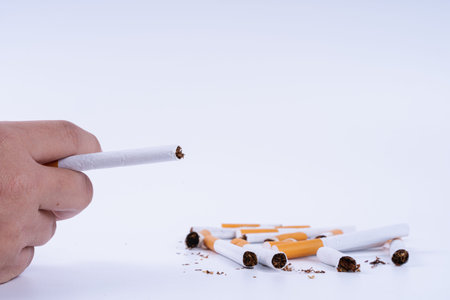 Man hold a cigarette with his hand. Stop smoking campaign. World no tobacco day.