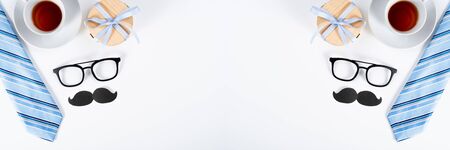 Happy Father Day background concept with blue necktie, glasses, wallet and gift box on white background with copy space for text.の写真素材