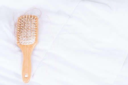 Hair fall problem, closeup comb with problem hair. Healthcare medical or daily life concept.の写真素材