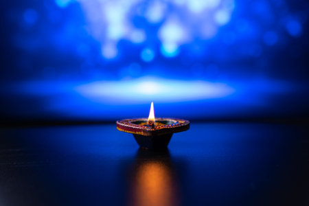 Indian festival Diwali, Diya oil lamps lit on colorful rangoli. Hindu traditional. Happy Deepavali....