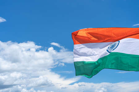 Waving India flag under blue sky background.の写真素材