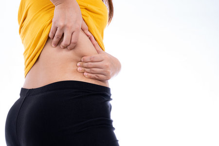 Fat woman holding excessive lower back, overweight fatty isolated white background. Diet lifestyle,...