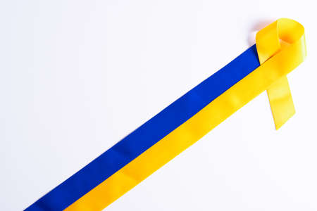 Down syndrome day with blue yellow ribbon awareness support patient with illness disabilityの写真素材