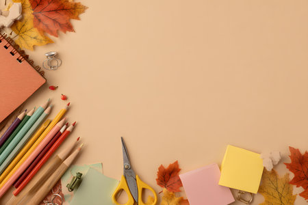 Kids draw with colorful pencils, scissors, and notebook for autumn activities.の素材