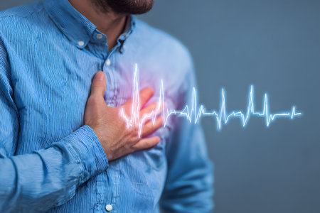 A person feels pain in chest with heartbeat graphic.の素材