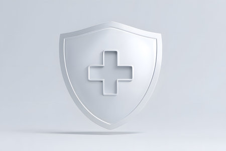 A white shield displays a medical cross protecting healthcare services.の素材