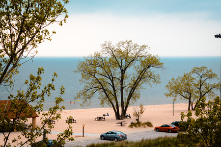 Looking down at tourist enjoying Lake Michigan from the sand duneの写真素材