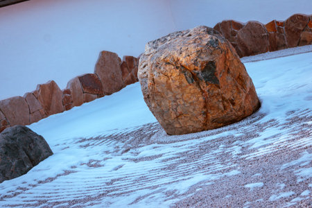 Stone garden covered in snowの写真素材