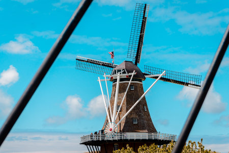 Framed shot of De Zwaan  windmill in Holland Michigan from the bridge