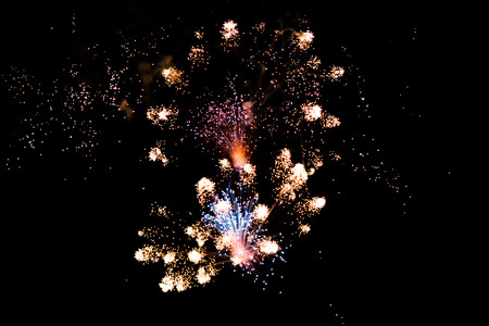 close up of a cluster firework exploding and shooting off during a displayの写真素材