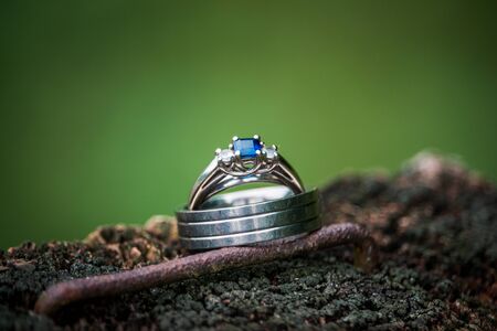 Close up shot of a pair of wedding rings on a fence post at a wedding in Pennsylvaniaの写真素材