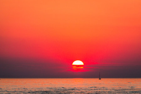 Sun dropping below the horizon of Lake Michigan in South Havenの写真素材