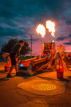man play skee ball the shoots out fire