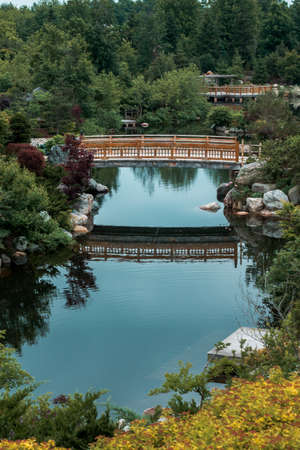 Reflections of the bridge on the lake in the Japanese garden in Grand Rapids Michiganのeditorial素材
