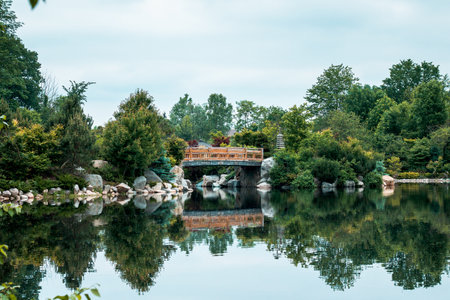 The bridge at the japanese garden reflecting in the lake on a still dayのeditorial素材