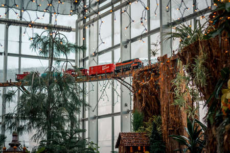 Model locomotive train on a bridge in a greenhouseのeditorial素材