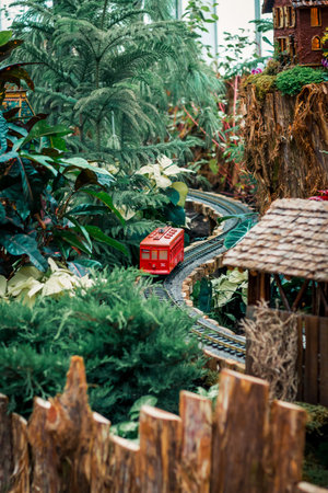 Trolley train running through a holiday train displayのeditorial素材