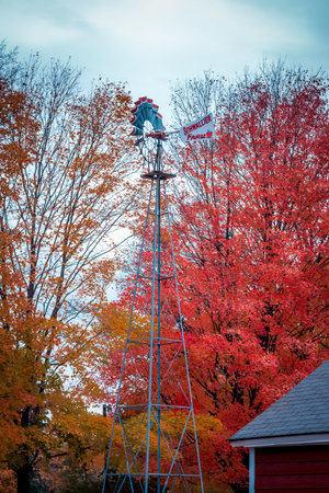 Windmill and weather vane at an orchard in the fallのeditorial素材