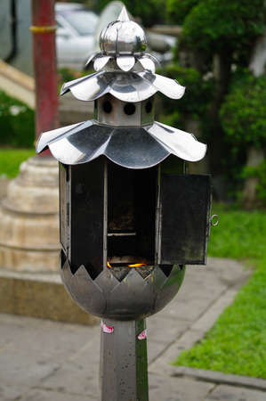 Candle handle in a temple in Thailandの写真素材