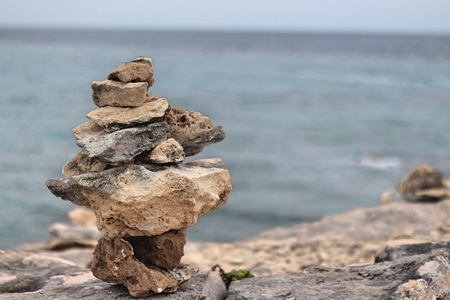 Cairn on the cliff of the Caribbean Seaの写真素材