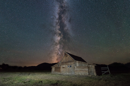 Milky Way Galaxy behind Moulton Barn in Wyomingの写真素材