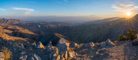 Sunburst over a mountain range from Joshua Tree National Park
