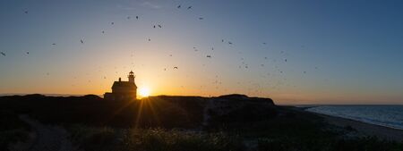 North Lighthouse sunset panorama on Block Islandの写真素材