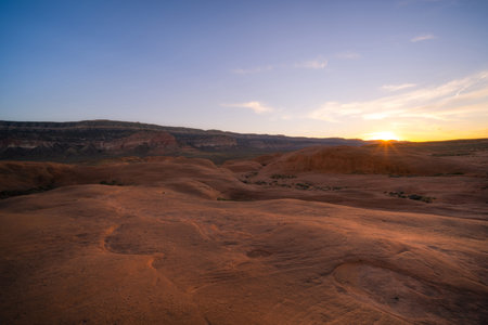 Setting sun near dance hall rock in Escalante Utah