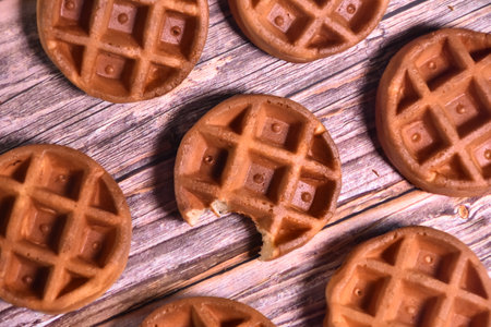 Belgian waffles on rustic wooden background. Top view.の写真素材