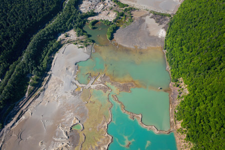 Drone view of the turquoise lake formed as a result of mining wasteの写真素材