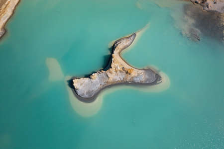 Drone view of the turquoise lake formed as a result of mining wasteの写真素材