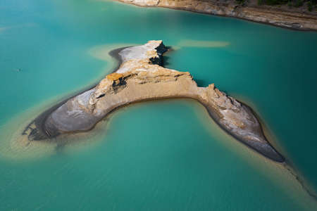 Drone view of the turquoise lake formed as a result of mining wasteの写真素材