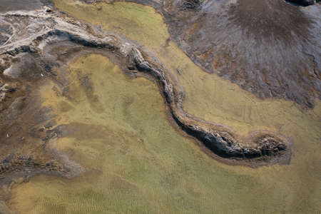 Drone view of the turquoise lake formed as a result of mining wasteの写真素材