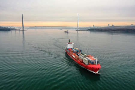 Drone view of the a pilot boat and container vessel in motionのeditorial素材