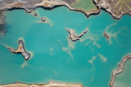 Drone view of the turquoise lake formed as a result of mining wasteの写真素材