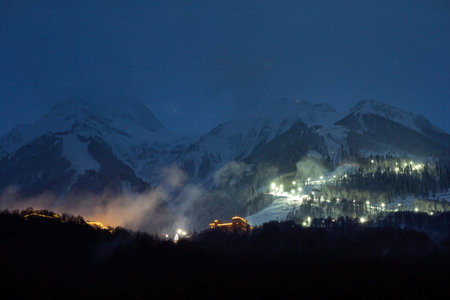 Night view of the Krasnaya Polyana ski resort from the valley