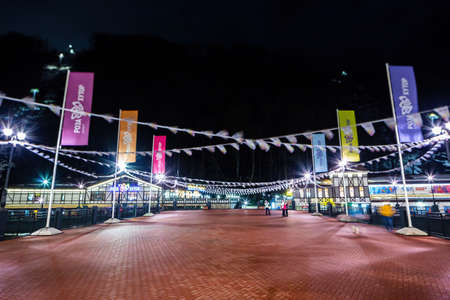Night view of the bridge with waving flags across the Mzymta Riverのeditorial素材