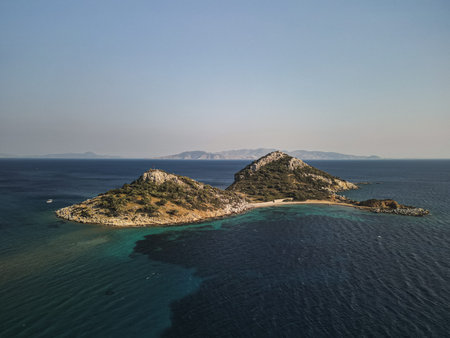 Twin islets and sandbar of Yassica Islands in Fethiye bay, Turkey at noonの写真素材